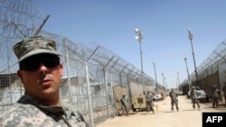 U.S. soldiers guard Camp Bucca on the outskirts of Basra.