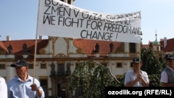 Uzbekistan is called out in the U.S. report, along with Iran, China, and Burma. Here, exiled opponents of Uzbek President Islam Karimov hold a demonstration in Prague on September 2.