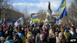 People gather on February 25 at the Place de la Republique in Paris as they take part in a demonstration in solidarity with Ukraine.