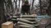 A Ukrainian soldier prepares 155mm artillery shells near Bakhmut, eastern Ukraine, in March. 