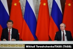 Xi and Putin speak in Moscow on March 21.