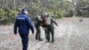 Serbian police take part in a raid to prevent migrant smuggling on October 31. a