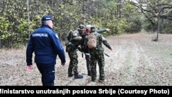 Serbian police take part in a raid to prevent migrant smuggling on October 31. a