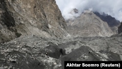 Tariq Jamil checks the ice on the Shisper glacier on October 10.