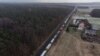 Trucks wait in line at the Polish-Ukrainian border at Hrebenne, southeastern Poland, on November 27.