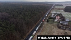 Trucks wait in line at the Polish-Ukrainian border at Hrebenne, southeastern Poland, on November 27.