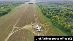 A view of an Ural Airlines aircraft that crash-landed near the village of Ubinskoye in Russia's Novosibirsk region in September 2023.