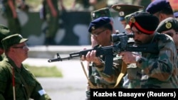 An Indian Army officer aims a Russian assault rifle while visiting a range outside the Russian city of Vladikavkaz. India imports much of its military hardware from Russia. (file photo)