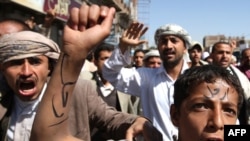 A young Yemeni protester with the word "Leave" written across his forehead at an antigovernment demonstration in the capital, Sanaa, on February 23