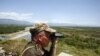 A Russian border guard patrols Abkhazia's border with Georgia proper near the bridge across the Inguri River.