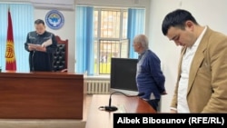 Activist Ondurush Toktonasyrov (center) in court on March 22.