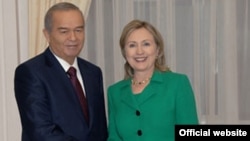 U.S. Secretary of State Hillary Clinton with Uzbek president Islam Karimov in Tashkent.