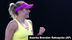 Ukraine's Kateryna Baindl celebrates after winning against Russia's Kamilla Rakhimova in their first round match at the Australian Open tennis championship in Melbourne on January 16. 