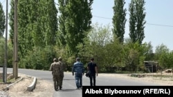 Soldiers walk through the village of Dostuk in Kyrgyzstan's Batken region on April 13. 