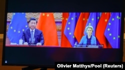 Chinese leader Xi Jinping (left) and European Commission President Ursula von der Leyen speak via video conference during an EU-China summit in April. 