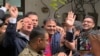 Police officials escort the Pakistan's former information minister Fawad Chaudhry (center) to present him before a court in Lahore on January 25, 2023. 