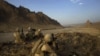 U.S. Marines keep watch on a hilltop during a patrol in Helmand Province on September 21.