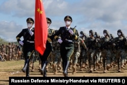 Chinese soldiers take part in a ceremony opening the Vostok 2022 military exercises at a firing ground in Russia's Far Eastern Primorsky region on August 31.