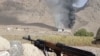 A still image from a video released by the Kyrgyz Border Guard Service shows what it said as an active military confrontation on the Kyrgyz-Tajik border as seen from an unidentified location in the Batken region.