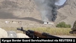 A still image from a video released by the Kyrgyz Border Guard Service shows what it said as an active military confrontation on the Kyrgyz-Tajik border as seen from an unidentified location in the Batken region.