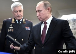 Russian President Vladimir Putin with Interior Minister Vladimir Kolokoltsev in February 2019.