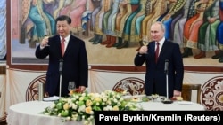 Xi Jinping and Vladimir Putin share a toast on March 21 during the Chinese leader's three-day visit to Moscow.