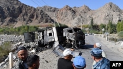 A burned-out truck sits on a road near the Kyrgyz-Tajik border in the village of Ak-Say, some 1000 kilometers from Bishkek, on September 20.