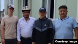 Aidarbek Khaidarov (second from right) told RFE/RL on July 10 that he and 10 other Kyrgyz nationals who had been detained at different times since last year were released in recent days.