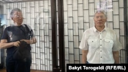 Former Kyrgyz President Almazbek Atambaev (right) in court on June 28. 