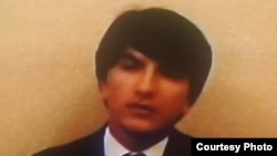 Khushdil Qurbonov bears a resemblance to the president's son.