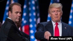 Republican presidential candidate Donald Trump (right) stands on stage with Rick Gates during a walk-through at the Republican National Convention in Cleveland on July 21, 2016.