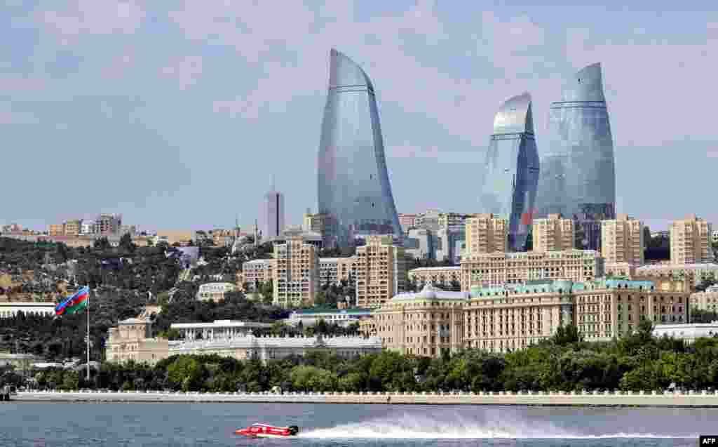 A view of the capital with the city&#39;s modern landmark, the 190-meter-high Flame Towers, dominating the skyline during a powerboat race in Baku.