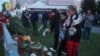 Mourners leave flowers at a makeshift memorial near School No. 175.