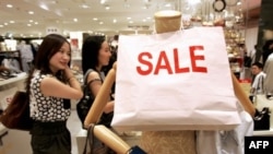 Are the world's shoppers waiting for prices to stop falling?