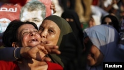 Supporters of Muhammad Morsi celebrate his victory on Tahrir Square in Cairo.