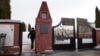 A Russian policeman walks through the gate of the Borisovskoye cemetery on February 28 where the funeral of Russian opposition leader Aleksei Navalny will be held on March 1.