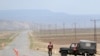 Turkish soldiers guard a road at Dogu Kapi, on the Turkish-Armenian border, on April 15.