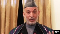 Afghan President Hamid Karzai at a press conference in Kabul on December 8.