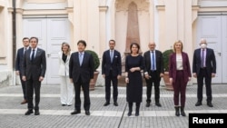 Ukrainian Foreign Minister Dmytro Kuleba (far left) and EU foreign policy chief (far right) pose with G7 foreign ministers after a meeting at the Munich Security Conference on February 19. 