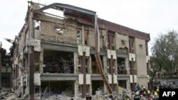 Aftermath of a bomb blast December 8 outside a criminal court building in west Baghdad's Mansur district