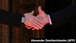 Russian President Vladimir Putin (left) shakes hands with U.S. President Joe Biden during their meeting in Geneva on June 16.