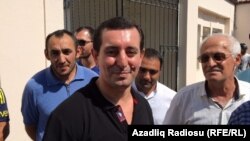 Faiq Amirli (center) is shown after his release on September 15.