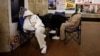 People take shelter in a subway station during a Russian missile strike in Kyiv on March 24.