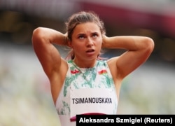 Krystsina Tsimanouskaya reacts after competing in a preliminary heat in Tokyo on July 30.