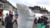 A WWF-sponsored artist carves an ice sculpture of a polar bear in Copenhagen to highlight the UN Climate Conference that is set to begin on December 7.