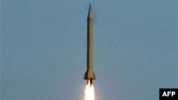 An earlier version of the Shahab-3 ballistic missile is test-fired in the desert outside the city of Qom in late 2006.