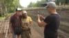 Aleksandr Gabyshev (center) walked hundreds of kilometers and spoke with hundreds of people along the way.