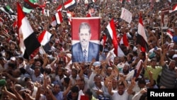 Thousands of Morsi supporters celebrate his victory in Tahrir Square.