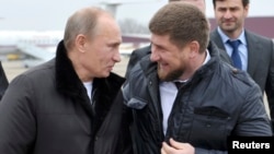 Vladimir Putin with Chechen leader Ramzan Kadyrov (right) in 2011.