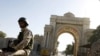 An Iraqi soldier drives through Baghdad's fortified Green Zone on January 1, the same day U.S. forces handed over official control of security there to Iraq.